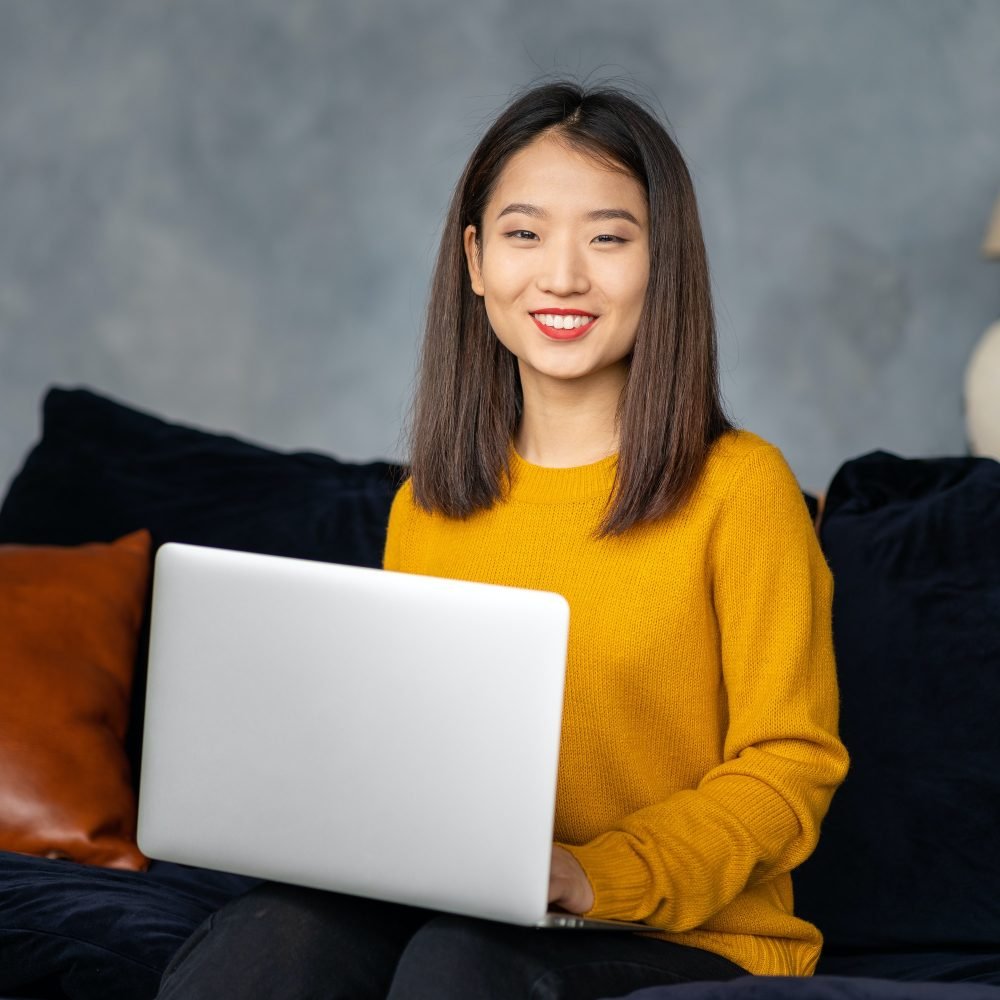 asian-business-woman-working-in-laptop-on-sofa-japanese-businesswoman-work-at-home.jpg