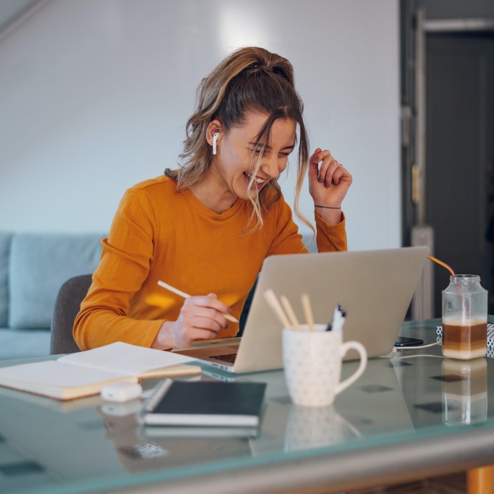 woman-having-web-call-on-a-laptop-while-working-at-home.jpg